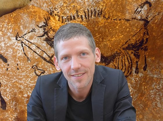 Prehistoric Cave Artwork with an Archaeologist